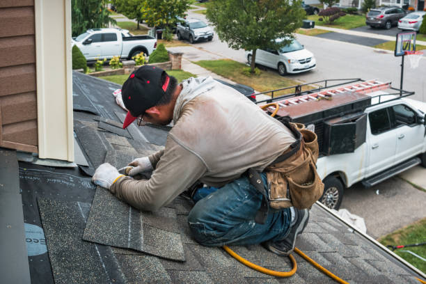 Professional Storm Damage Roof Repair technician working in Elkhart, IA